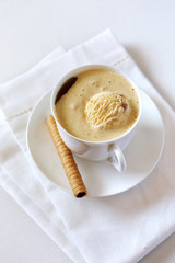 Black coffee with ice cream and chocolate stick