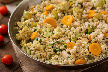Tasty pearl barley porridge with vegetables and chicken