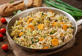 Tasty pearl barley porridge with vegetables and chicken