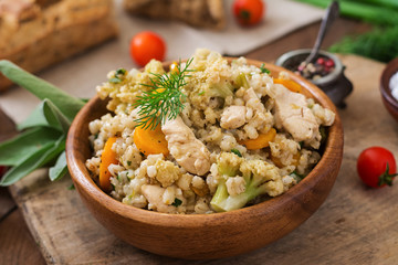 Tasty pearl barley porridge with vegetables and chicken