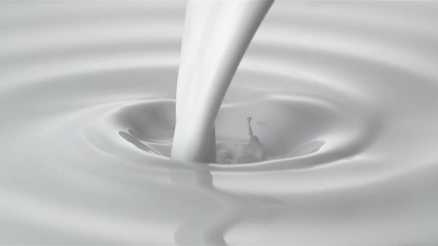 Pouring milk into swirl of milky liquid. Shot with high speed camera, phantom flex 4K. Slow Motion. 