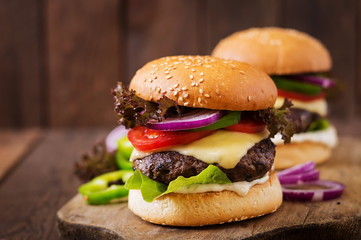 Big sandwich - hamburger burger with beef, cheese, tomato and tartar sauce