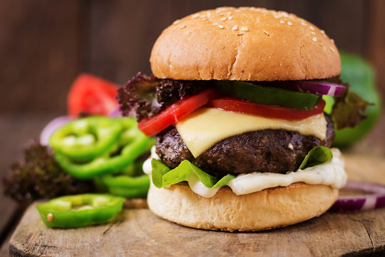 Big sandwich - hamburger burger with beef, cheese, tomato and tartar sauce