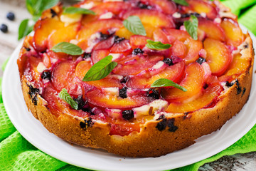 Delicate biscuit pie with peaches and blueberries.