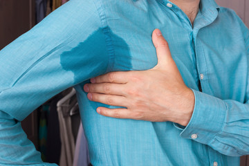 Sweaty spot on the shirt because of the heat, worries and diffid