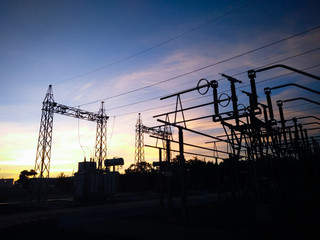 Structure protection devices and power transformers, blue sky background.