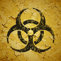 Black emblem painted on grunge wall - biohazard logo