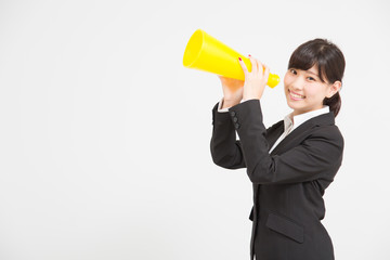 Fototapeta premium メガホンで応援をするスーツの女性