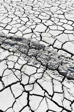 Cracked earth near mud volcanoes