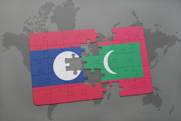 puzzle with the national flag of laos and maldives on a world map background.
