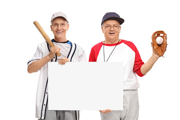 Retired baseball players holding a sign