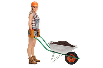 Female worker with a pushcart full of dirt