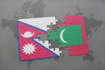 puzzle with the national flag of nepal and maldives on a world map background.