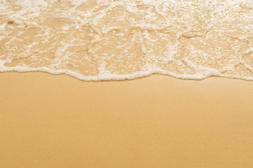 Fototapeta na wymiar wave on the sand beach