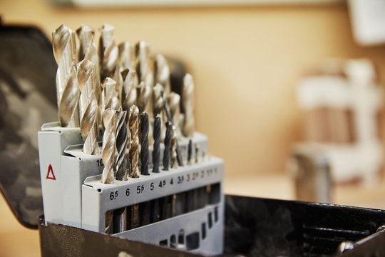 A furniture workshop. Drill bits arranged in a box neatly. 
