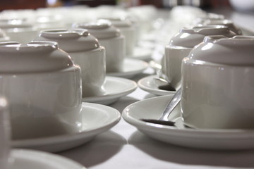 a ground perspective of teacups in rows