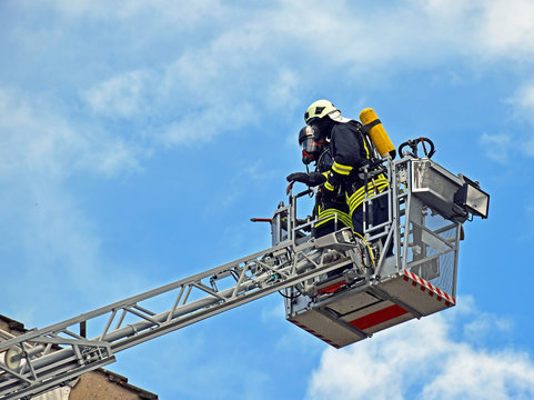 Firefighters on a ladder 