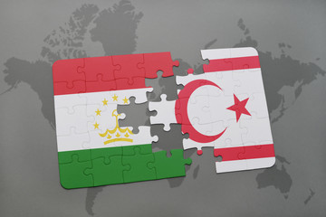 puzzle with the national flag of tajikistan and northern cyprus on a world map background.