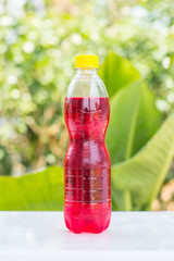 bottles with tasty drinks white nature background