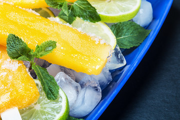 Homemade popsicles with lemon and mint