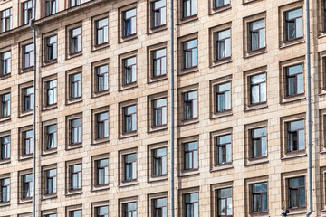 Fototapeta na wymiar brick wall of a residential building with windows