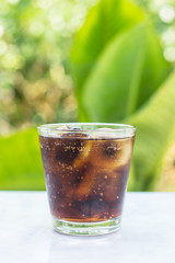 soft drink in a glass with ice cubes