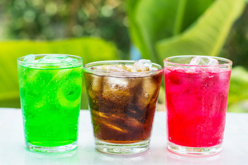 Fototapeta na wymiar soft drink in a glass with ice cubes