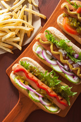 grilled hot dogs with vegetables ketchup mustard