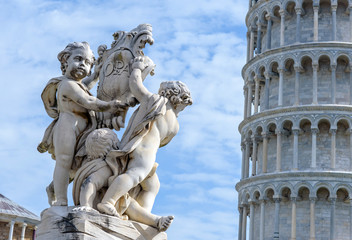 Fototapeta na wymiar statue of angels and leaning tower, Pisa, italy