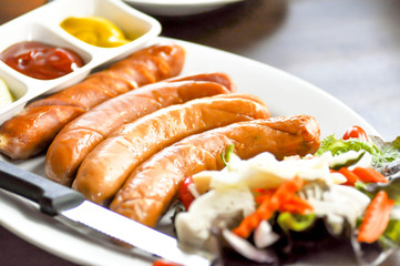 pork and beef sausage  with sauce and vegetable