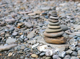 Fototapeta na wymiar Pyramid from a sea pebble.