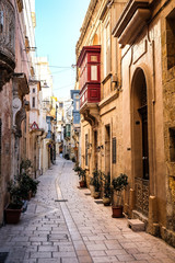 Valletta iconic narrow city streets at sunset