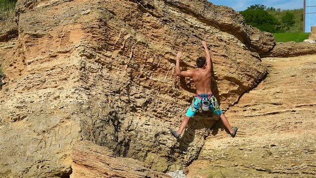 Extreme Climber Climbing On A Rock. Slow Motion Effect