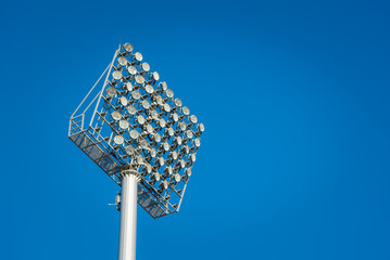 Stadium light against blue sky..