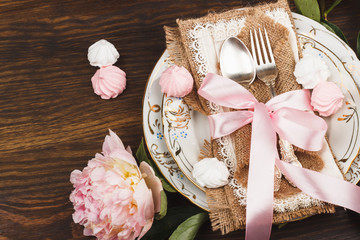 Tableware with light pink peonies and meringues
