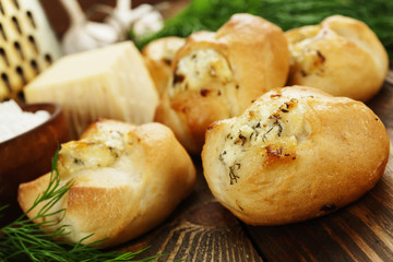 Baked buns stuffed with cheese and herbs - 116956320