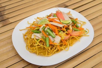 pressed pork spicy salad with vegetables and fired noodle