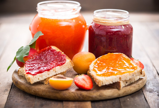 Strawberry and apricot jam on the bread 