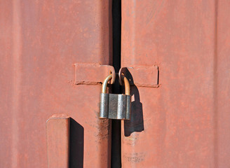 Rusty lock on garage gate
