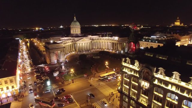 Beautiful night flight in the center of St. Petersburg Russia. Nevsky prospect, Kazan cathedral, Zinger house from unique perspective. Evening illumination. Epic aerial shot. 4k footage.