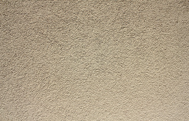 Colored plaster as a background,  beige plaster wall, horizontal background 