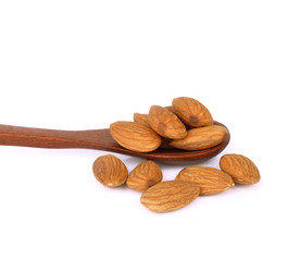 dried almond in wood spoon on white background