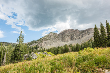 Stormy cloud in Albion basin mountains and alpine forest near Salt Lake City, Utah
