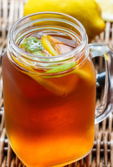 Summer refreshing drink. Citrus ice tea. Selective focus