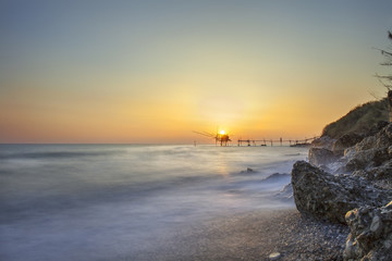 San Vito Chietino, Abruzzo, Italy: Trabucco Turchino. Ancient fishing machine in the sunrise light with silky sea