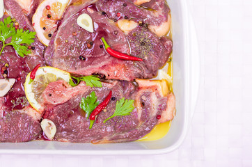 Steaks of red meat , marinated with emulsion of lemon juice and