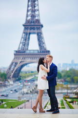 Romantic couple in Paris near the Eiffel tower