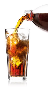 Cola poured into glass with ice