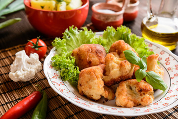 Breaded fried cauliflower with potatoes