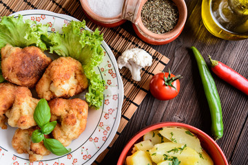 Breaded fried cauliflower with potatoes